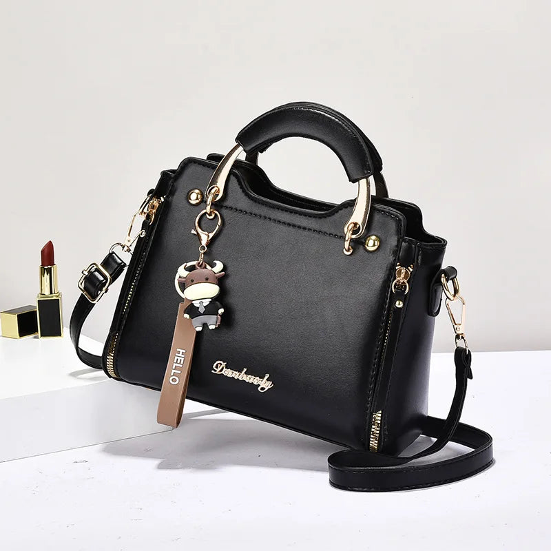 Printed monogram straddle leather bag.